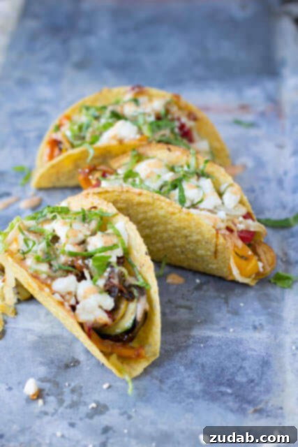 Vegetarian tacos with spicy crema. Fresh veggies sauteed and stuffed into a crunchy delicious taco topped with creamy queso fresco ohsweetbasil.com Vegetarian tacos with spicy crema. Fresh veggies sauteed and stuffed into a crunchy delicious taco topped with creamy queso fresco ohsweetbasil.com