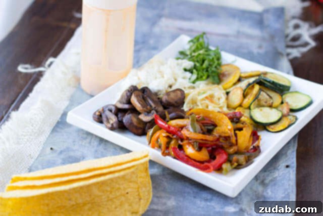 Vegetarian tacos with spicy crema. Fresh veggies sauteed and stuffed into a crunchy delicious taco topped with creamy queso fresco ohsweetbasil.com Assortment of colorful bell peppers, mushrooms, and squash ready for sautéing in vegetarian tacos.