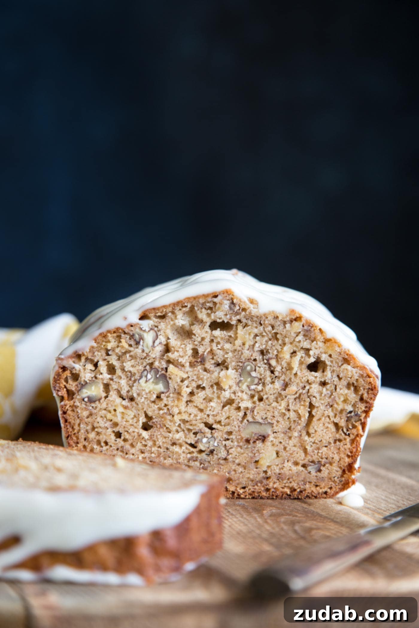 Hummingbird Banana Bread 5 A beautiful cross-section view of Hummingbird Cake Banana Bread, showing its moist crumb and fruit inclusions.