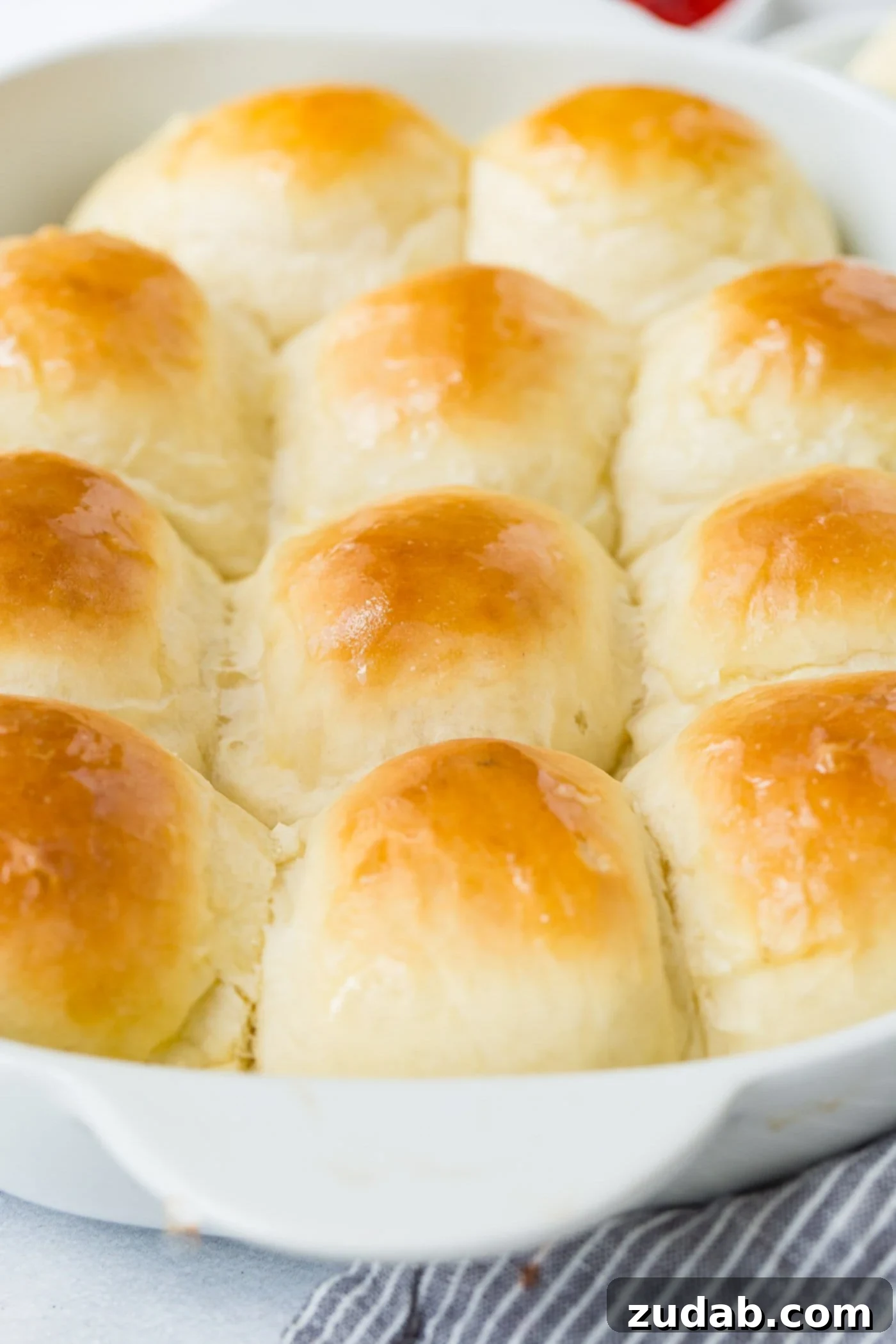 Dinner Rolls A pan of white dinner rolls that have been baked to a soft golden brown.