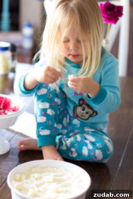 Lemon Blackberry Cobbler 2 Child helping prepare Lemon Blackberry Cobbler, a joyful baking experience, ohsweetbasil.com