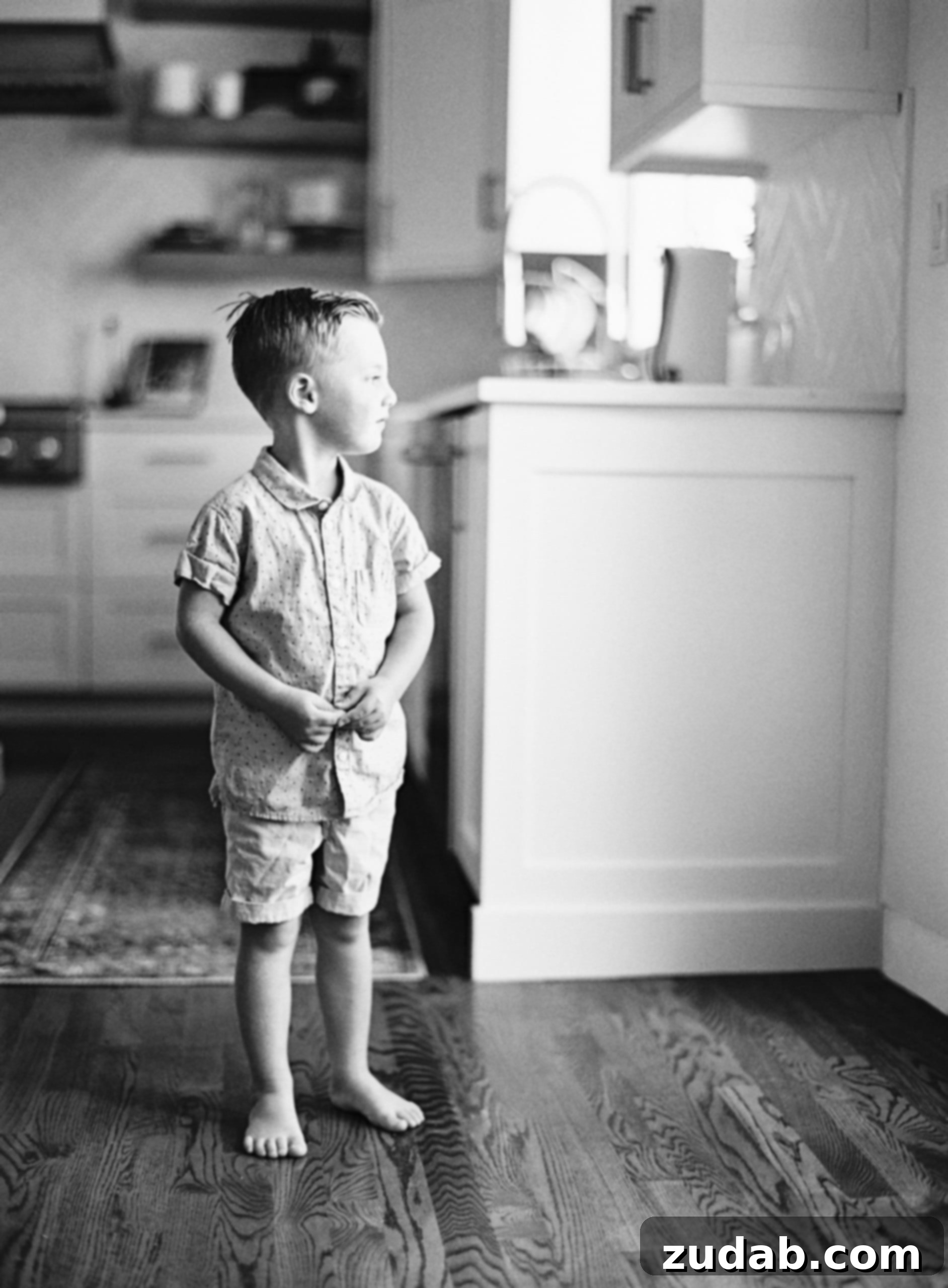 Hear Him: Finding Personal Direction A young boy gazes thoughtfully out a window, his expression conveying contemplation and perhaps a touch of anticipation for what lies ahead.