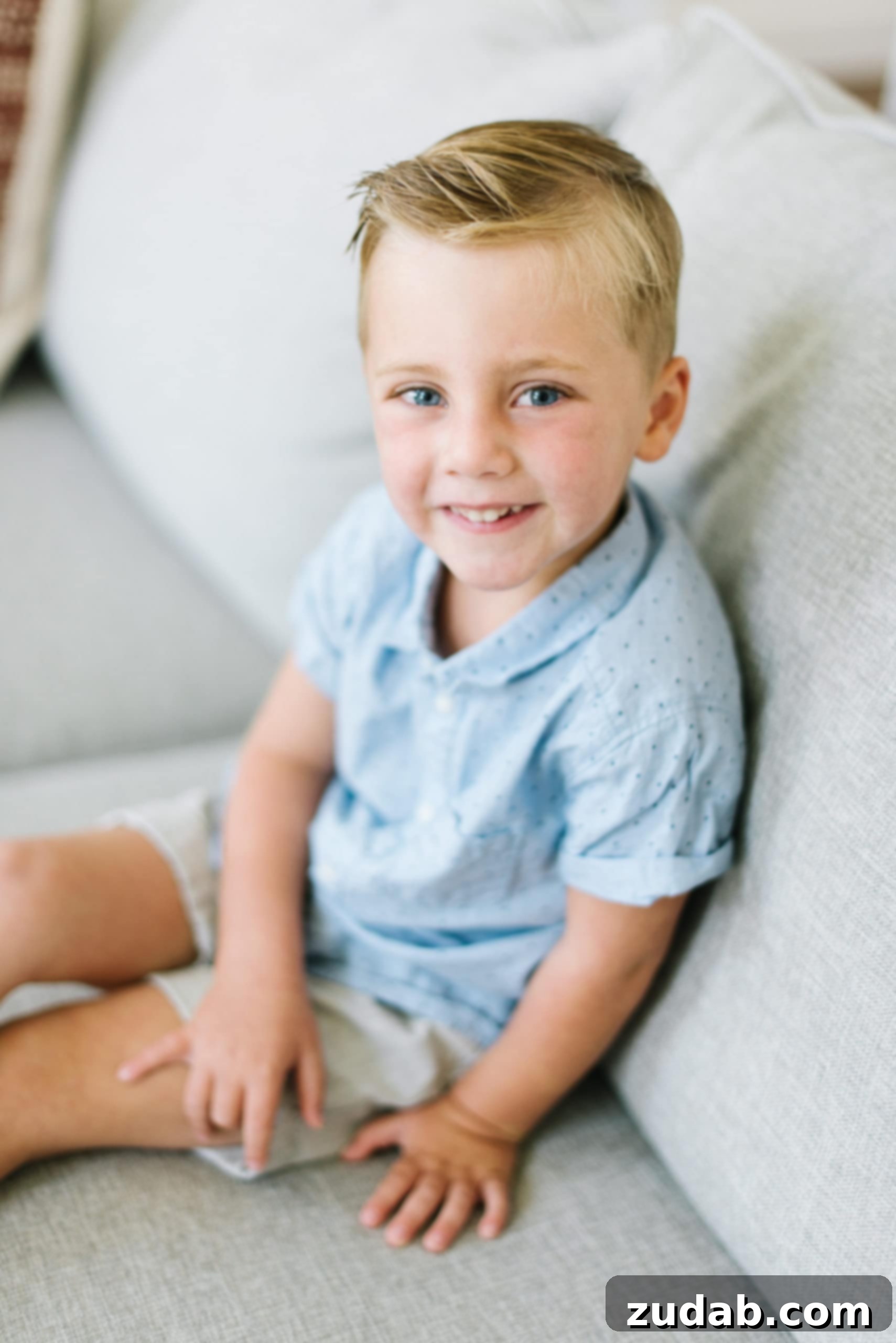 My Heart is Beating a photo of a young cute boy sitting on a couch, reflecting on the simple wonder of life