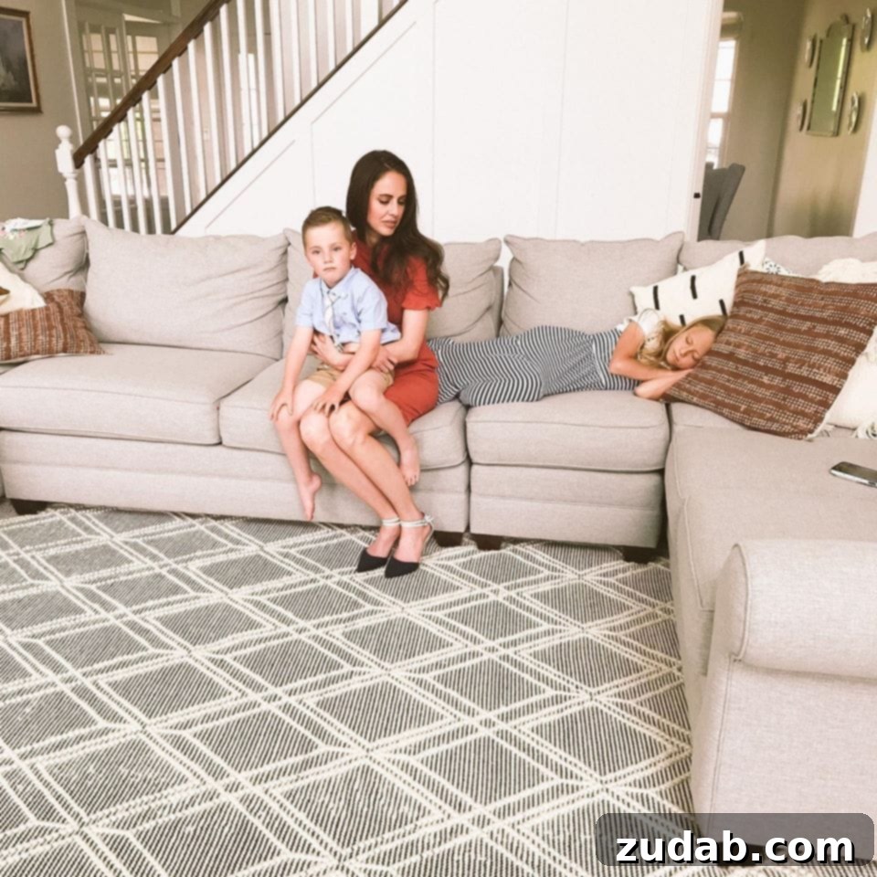 Life is Made of Patterns A photo of a mother holding her young son on the couch with her daughter laying on the couch next to them.