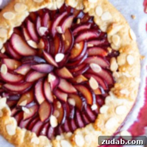 Rustic Plum Galette 6 A plum galette on a baking sheet, ready to be served.