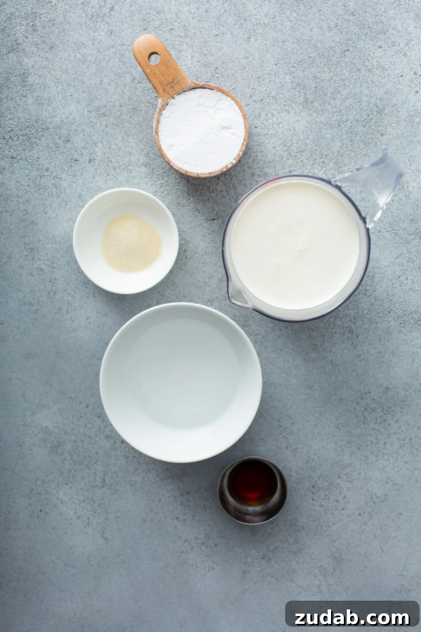 Stabilized Whipped Cream Ingredients Ingredients for stabilized whipped cream. Containers of whipping cream, powdered sugar, vanilla, water and gelatin.