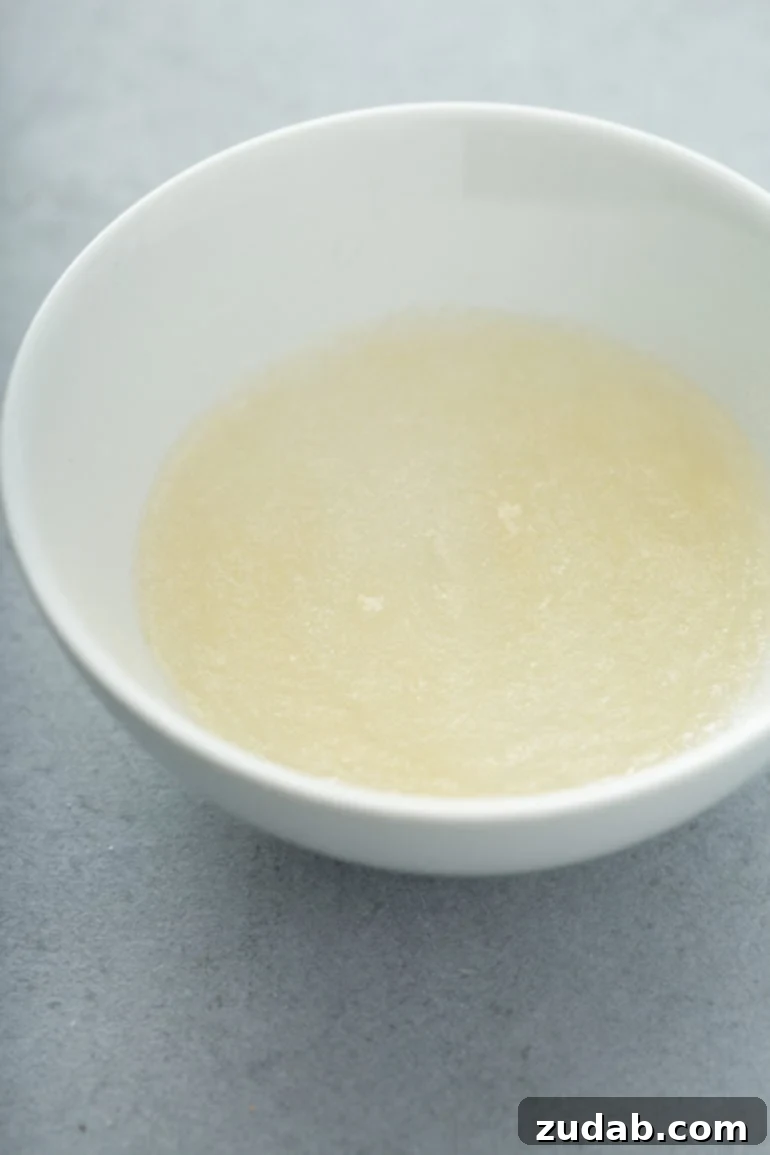 The Ultimate Guide to Foolproof Whipped Cream Stability 2 a mixing bowl with whipping cream.