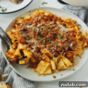 A vibrant bowl of homemade Plant Based Vegan Bolognese Sauce, showcasing its rich texture and color.