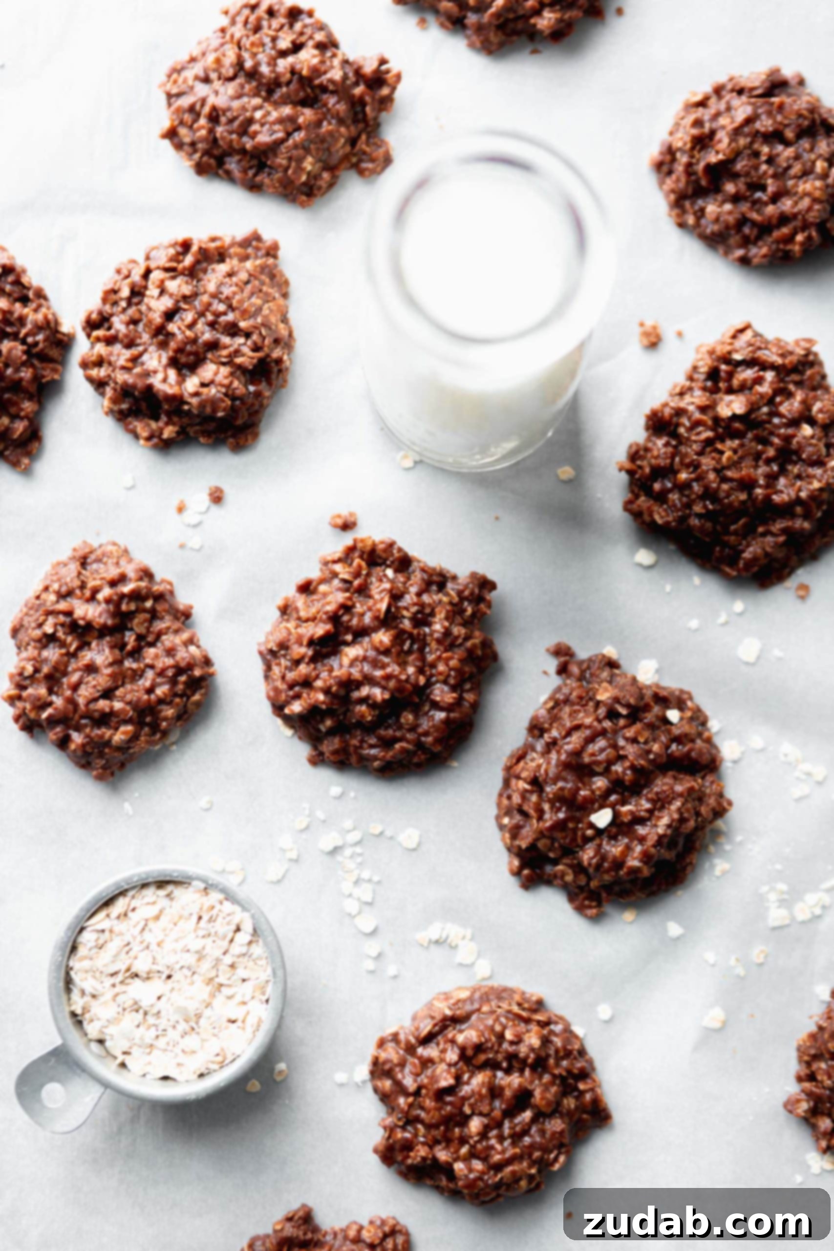 No bake cookies on parchment paper. They are a combination of oats and peanut butter mixed into chocolate.