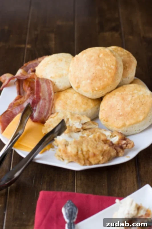 Mom cutting freshly baked biscuits made with King Arthur Self Rising Flour for a decadent breakfast sandwich Mom cutting freshly baked biscuits made with King Arthur Self Rising Flour for a decadent breakfast sandwich.
