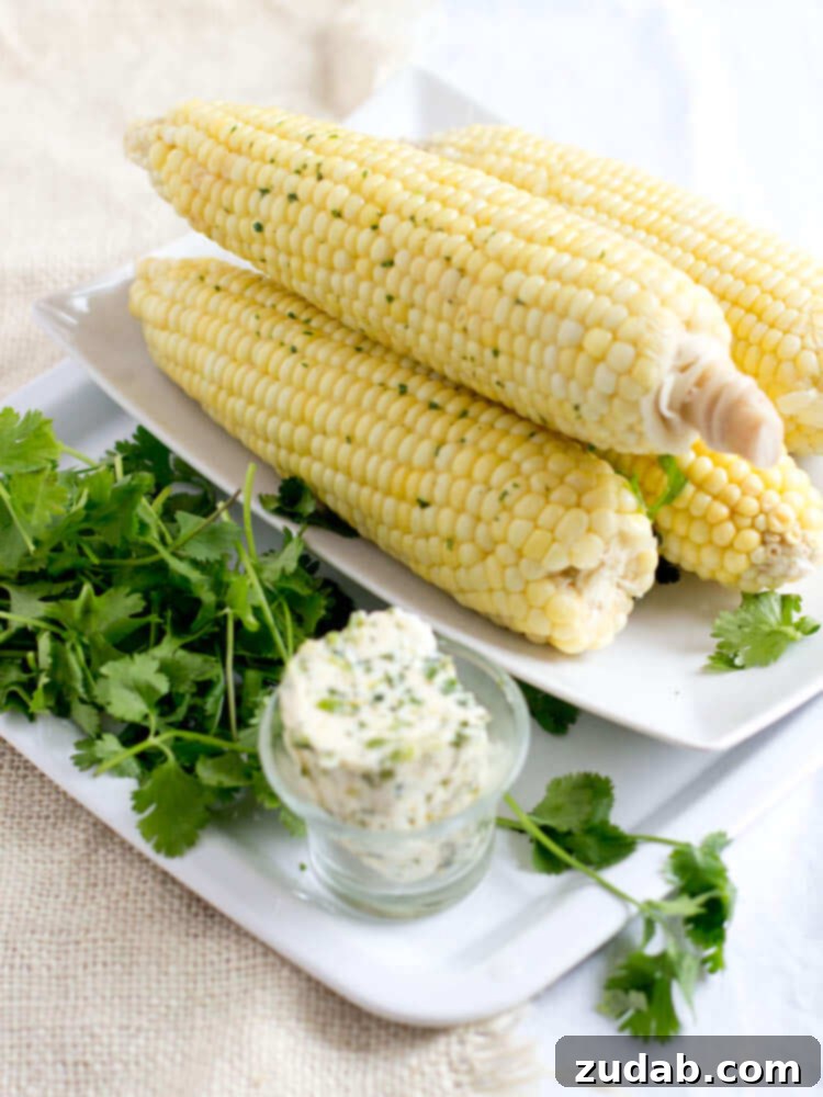 The Sudden Stop 5 Steamed corn with cilantro butter, a fresh and vibrant side dish.