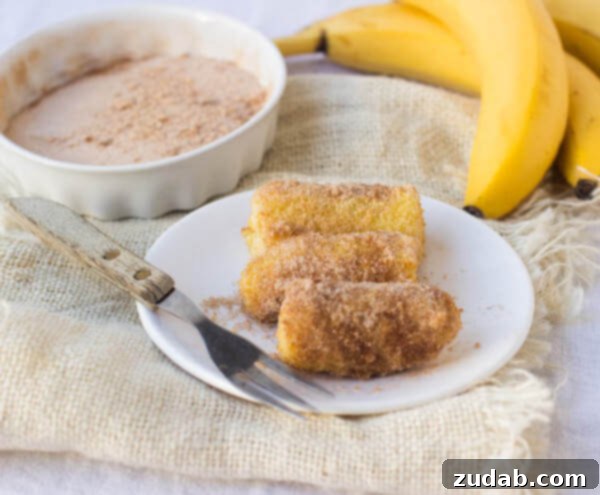 Easy Air Fryer Fried Bananas Recipe Platter of homemade fried bananas, glistening and ready to serve