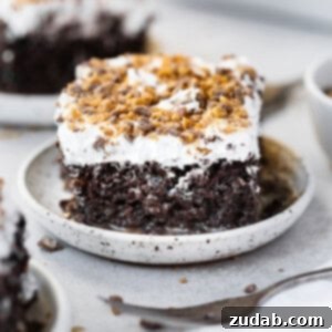 Better Than Anything Cake Recipe A piece of better than anything cake with chocolate cake with caramel and topped with cool whip and a crunchy topping