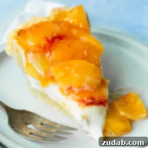 A delectable peaches and cream pie, showcasing its rich, creamy texture and vibrant peach topping, ready to be served.
