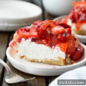 Luscious Strawberry Cheesecake Squares 7 A small image of a slice of creamy strawberry cheesecake bar.