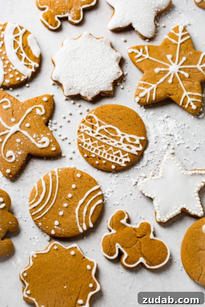 Festive Cookie Collection 5 A grey board displaying the best soft gingerbread cookies recipe, beautifully decorated with royal icing, highlighting their festive appeal.