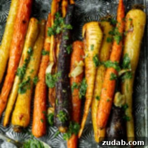 A beautifully presented serving of Lemon Roasted Carrots and Parsnips, showcasing the vibrant colors and caramelized edges, ready to be served.