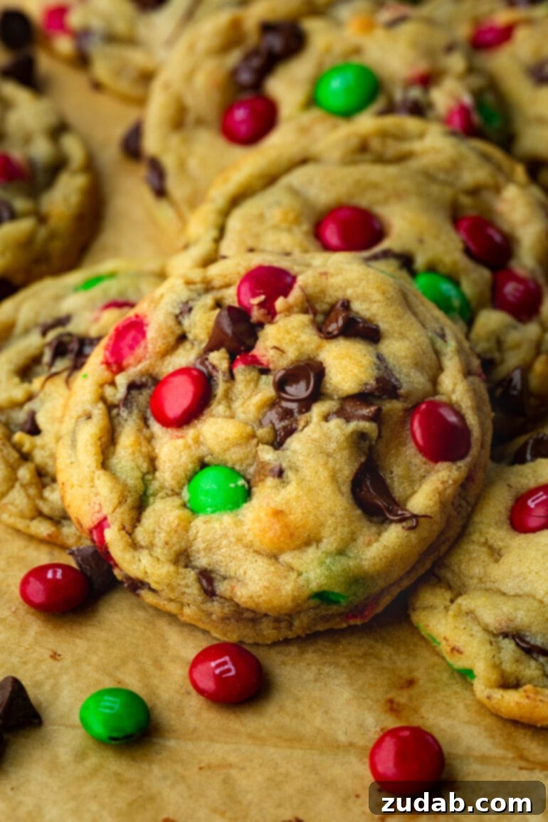 A delightful pile of golden-baked M&M Christmas chocolate chip cookies, perfect for holiday gifting or sharing.