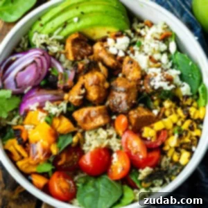 A delicious Mexican Chicken Burrito Bowl, beautifully garnished and ready to be enjoyed.