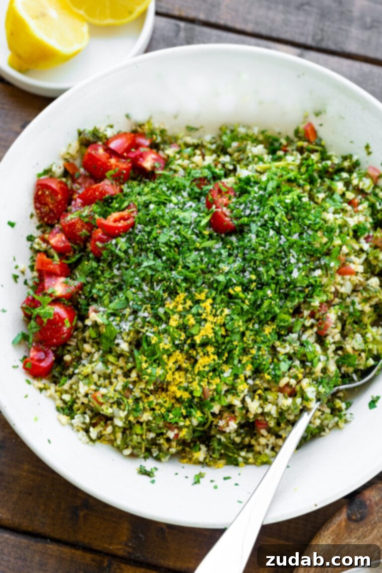Bright and Flavorful Tabbouleh 4 A pristine white serving bowl brimming with all the meticulously prepared ingredients for tabbouleh, showcasing the vibrant colors and fresh textures before tossing.