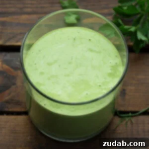 Velvety Basil Dressing Quick And Healthy 8 A glass container full of creamy basil dressing, featured in the recipe card.