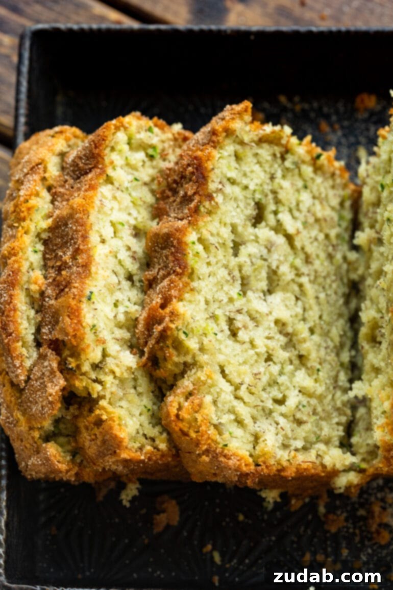 Ultimate Banana Zucchini Bread 5 A top-down photo showcasing several slices of banana zucchini bread beautifully arranged, highlighting its inviting texture.