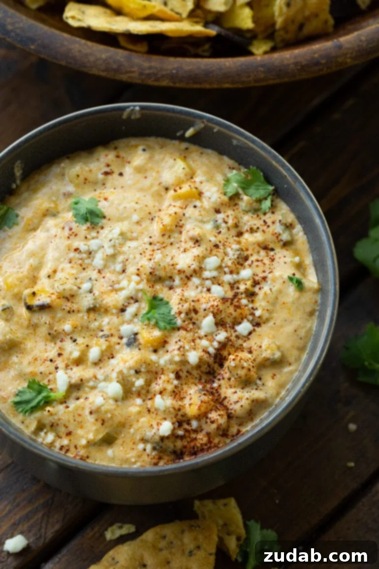 Creamy Slow Cooker Elote Dip 2 a photo of a large bowl of creamy mexican street corn dip.