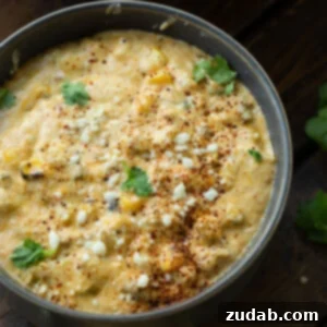 Creamy Slow Cooker Elote Dip 11 A bowl of Slow Cooker Mexican Street Corn Dip, ready to be served.