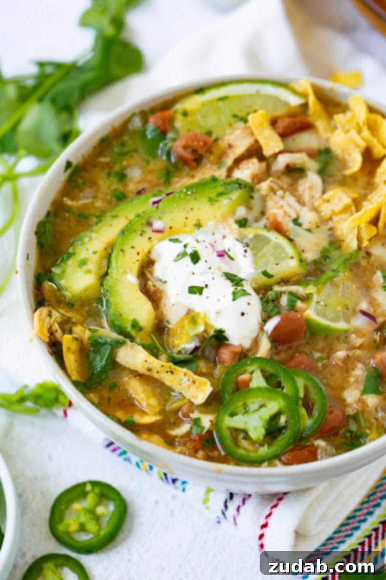 Meals for the Week September 25 October 1 7 A hearty and inviting bowl of White Chicken Chili, brimming with tender shredded chicken, creamy pinto beans, and mild green chiles, beautifully garnished with fresh cilantro and a dollop of cooling sour cream. A perfect comfort food recipe.