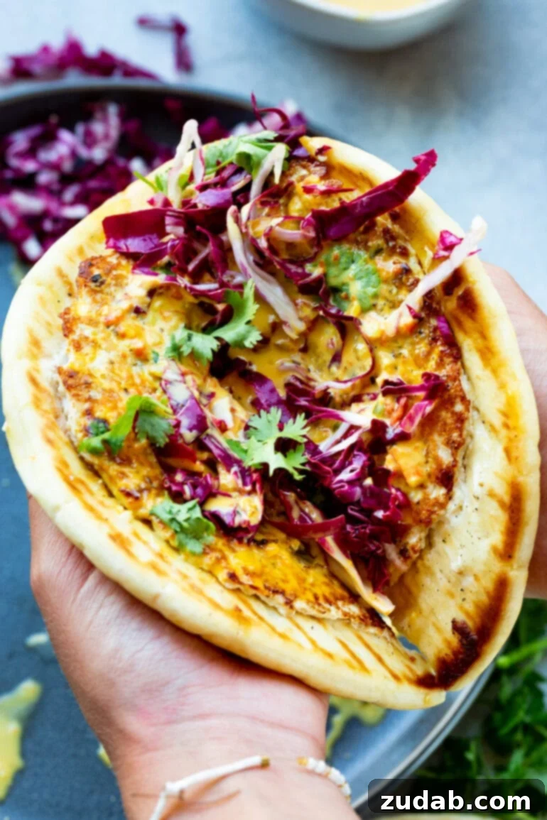 Meals for the Week September 25 October 1 9 A deliciously golden-cooked coconut curry chicken burger patty served on a piece of golden pita bread, generously lathered in curry sauce and topped with fresh radicchio and vibrant cilantro. This Indian-inspired burger offers a healthy and flavorful twist on a classic.