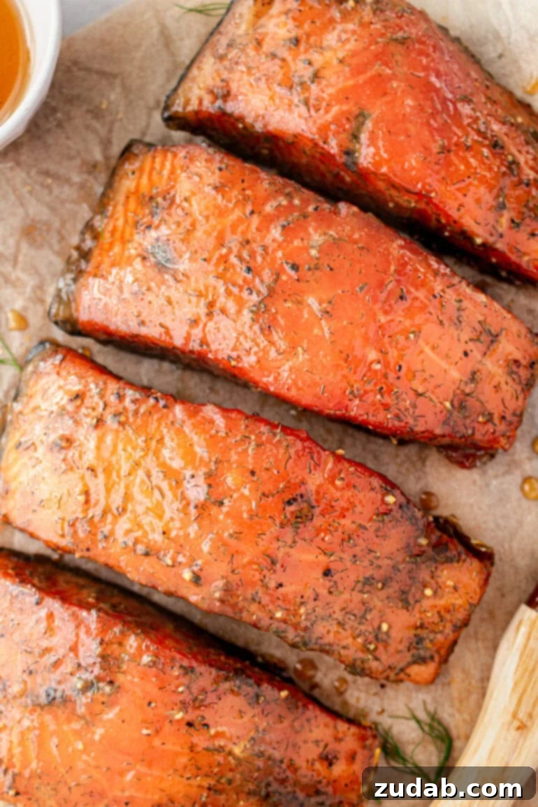 Perfect Smoked Salmon Recipe 2 a photo of several salmon filets that have been smoked and seasoned, glistening with a perfect glaze