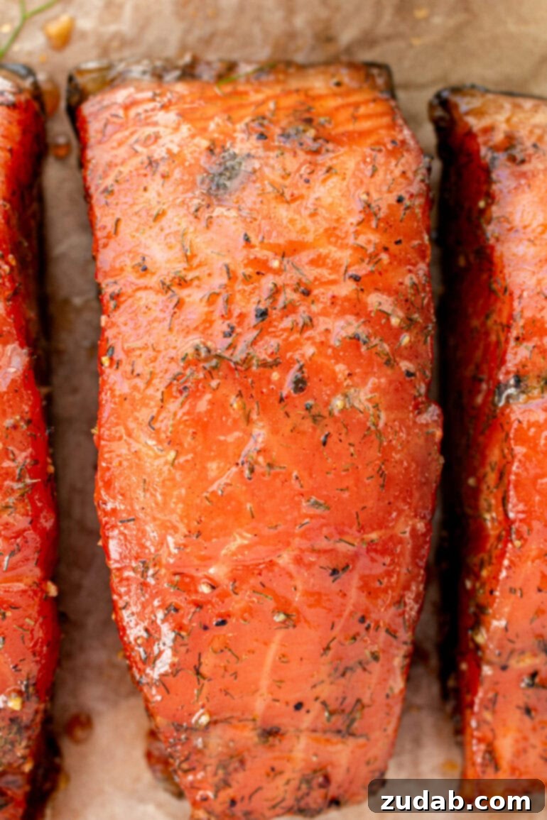 Perfect Smoked Salmon Recipe 11 a photo taken over the top of a beautifully smoked salmon fillet, showcasing its glistening glaze and perfect texture