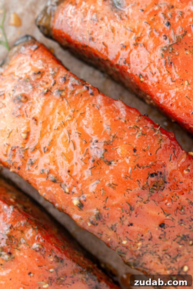 Perfect Smoked Salmon Recipe 6 a close-up photo of smoked salmon fillets coated in a sweet seasoned glaze, ready to be enjoyed