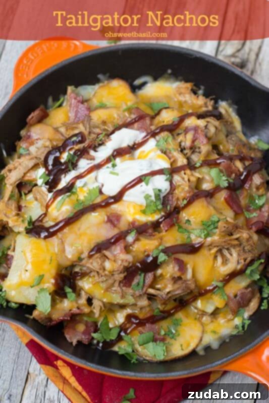 Tailgator Nachos loaded with BBQ Pork, roasted potatoes, Bacon and cheeeeeese!!! ohsweetbasil.com Tailgator Nachos loaded with BBQ Pork, roasted potatoes, Bacon and cheeeeeese!!! ohsweetbasil.com