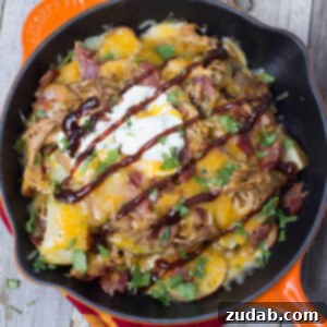 Gridiron Glory Nachos 2 Tailgator Nachos loaded with BBQ Pork, roasted potatoes, Bacon and cheeeeeese!!! ohsweetbasil.com
