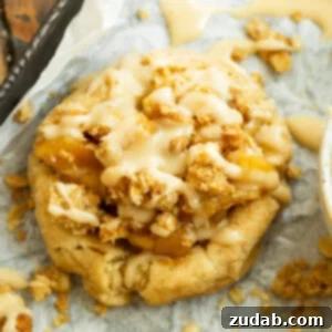 A delicious apple crisp cookie, featuring a golden-brown base, sweet apple filling, and crunchy oat topping.