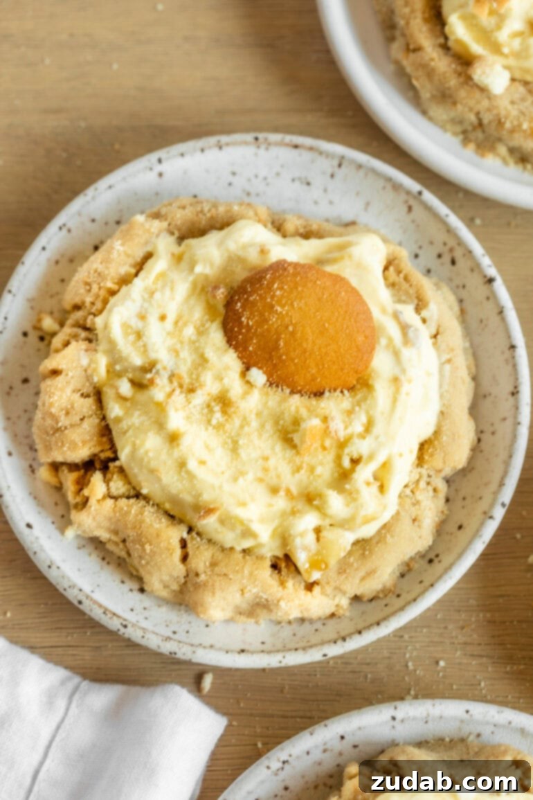A top-down view of a single banana cream pie cookie, beautifully topped with a Nilla wafer, inviting a delicious bite.