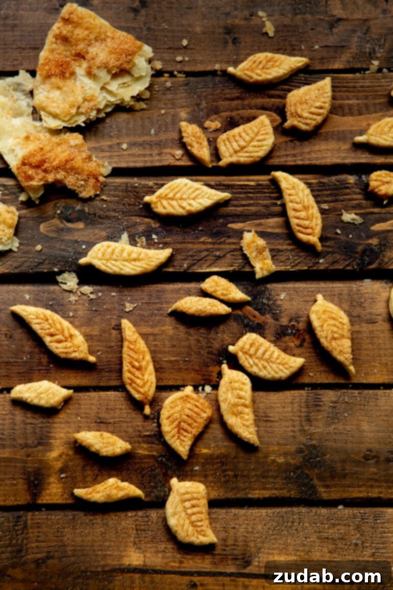 Pillowy Pumpkin Pie Cookies 7 A close-up photo of decorative pie crust leaves, baked to golden perfection, scattered artfully.