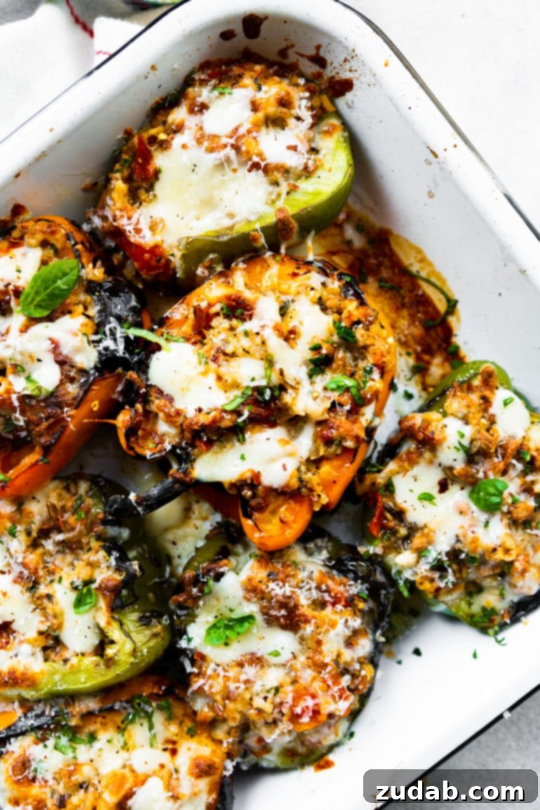 Meals for the Week of November 6-12 3 A baking dish filled with savory Italian stuffed bell peppers, generously topped with melted golden cheese, ready to be served as a comforting dinner.