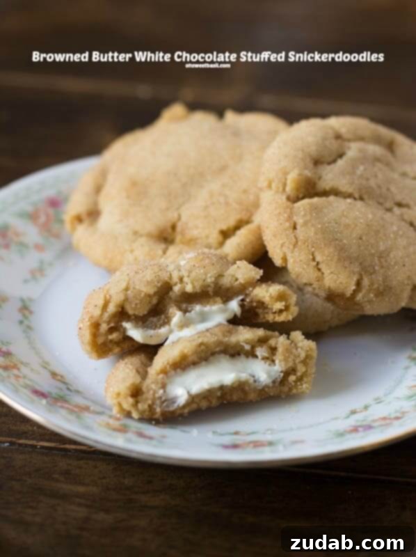 Warm, soft snickerdoodles with a golden brown edge and a rich white chocolate center.