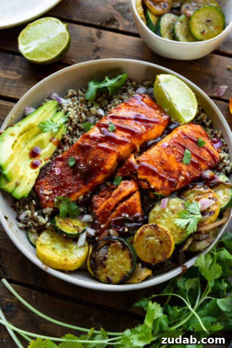 Perfect Air Fryer BBQ Salmon 3 a photo of two salmon fillets that have been air fried and topped with bbq sauce