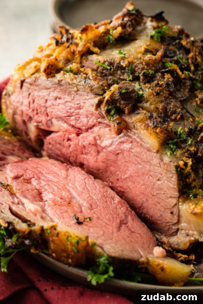 Weekly Meal Plan Dec 25 to 31 3 A glorious garlic prime rib, perfectly roasted and presented on a platter, ready to be carved for a festive Christmas dinner.