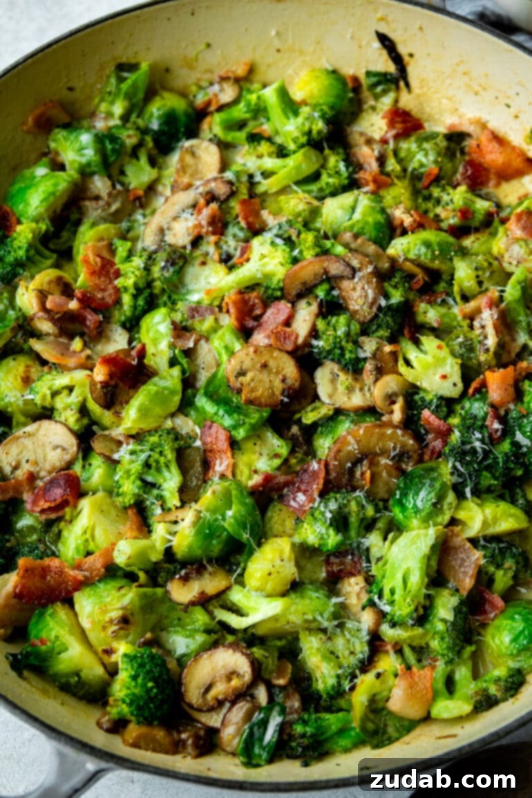 Luscious Garlic Parmesan Broccoli and Sprouts 5 A cast-iron skillet filled with a creamy medley of Brussels sprouts, broccoli, sliced mushrooms, and crispy bacon, fresh from the oven and ready to be served.