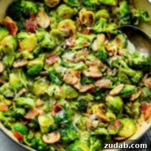 Luscious Garlic Parmesan Broccoli and Sprouts 8 A top-down view of the creamy garlic parmesan Brussels sprouts and broccoli with bacon and mushrooms in a cast iron skillet.