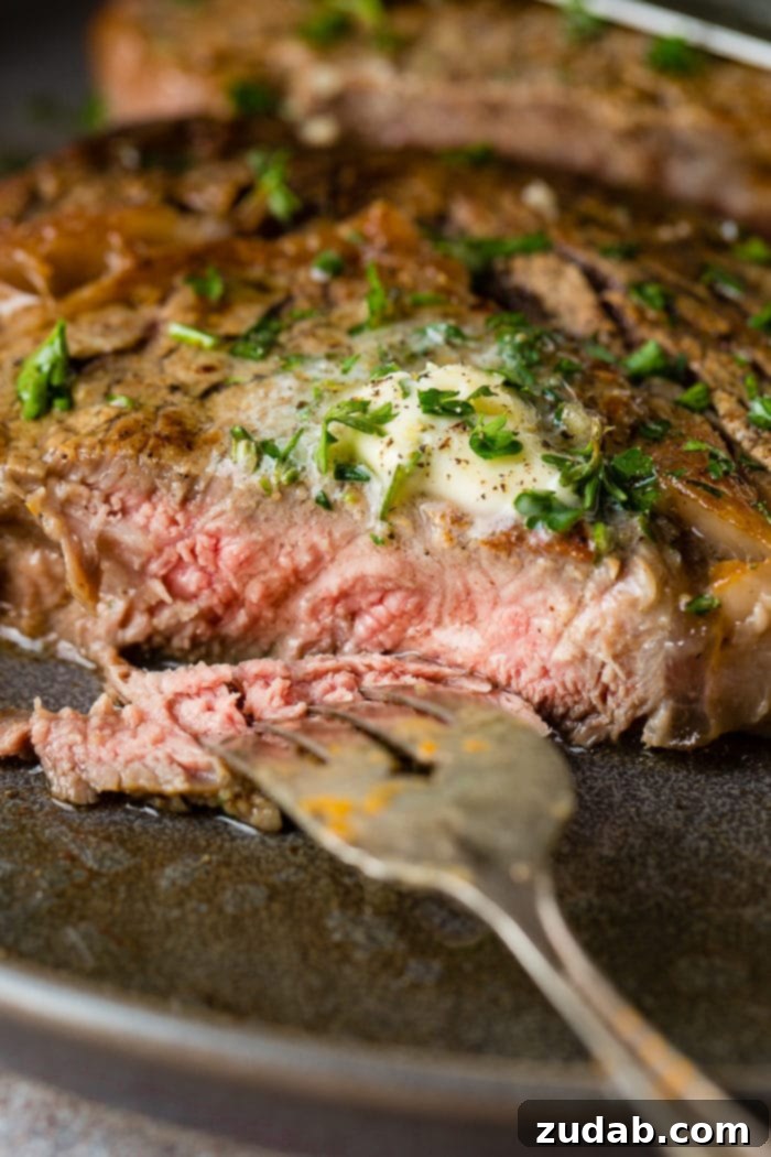 Weekly Meal Plan February 12 to 18 5 An exquisitely cooked Garlic Butter Steak, perfectly seared with a golden-brown crust and juicy interior, glistening with melted garlic butter, ideal for a special Valentine's Day dinner at home.