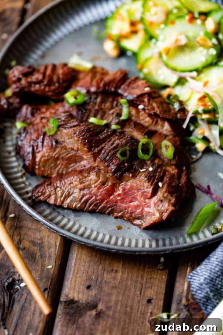 Your Weekly Meal Plan: Feb 26 - Mar 3 3 Thin slices of succulent Asian marinated flank steak, beautifully garnished with fresh chopped scallions, served alongside a crisp cucumber salad.