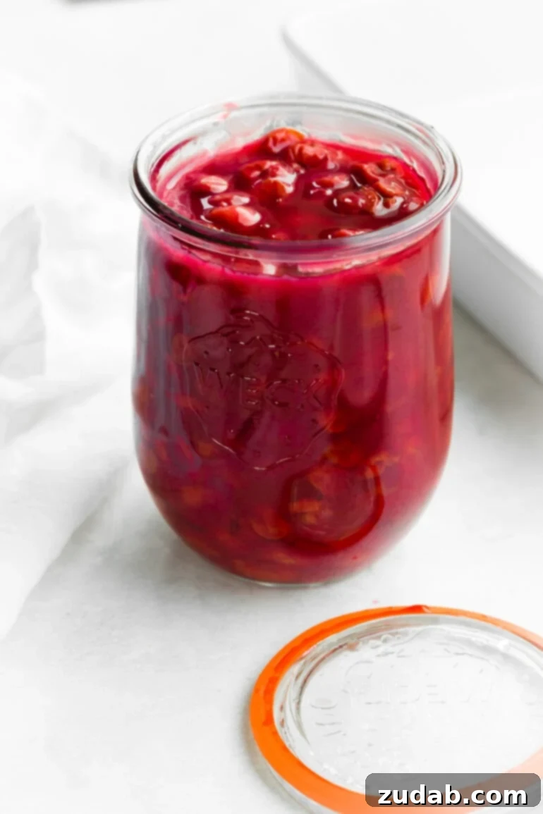 Luscious Homemade Cherry Pie Filling 4 a photo of a glass jar of homemade cherry pie filling