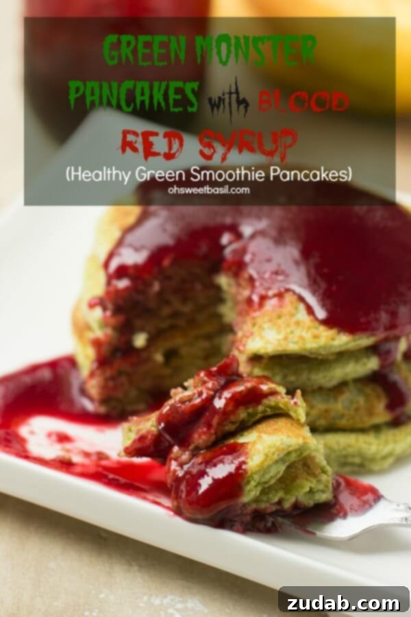 A stack of vibrant Green Monster Pancakes drizzled with rich red syrup, ready for a fun and healthy breakfast. A stack of vibrant Green Monster Pancakes drizzled with rich red syrup, ready for a fun and healthy breakfast.