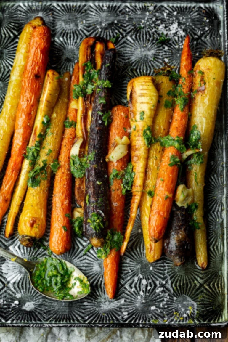 Your Ultimate Easter Sunday Feast 14 a photo of multi colored carrots and parsnips that have been roasted and drizzled in a lemon honey dressing.