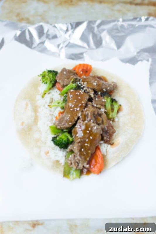 This Week's Menu: April 22-28 5 A vibrant and fresh Teriyaki Beef Wrap, filled with tender beef strips, crisp vegetables, and a savory sauce, ready to be enjoyed.